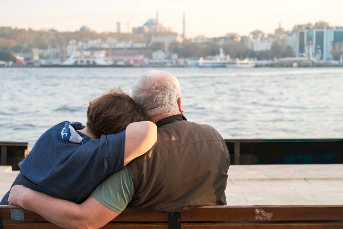 A heartfelt moment of an elderly couple embracing in Port Charlotte, FL, capturing the city's charm.