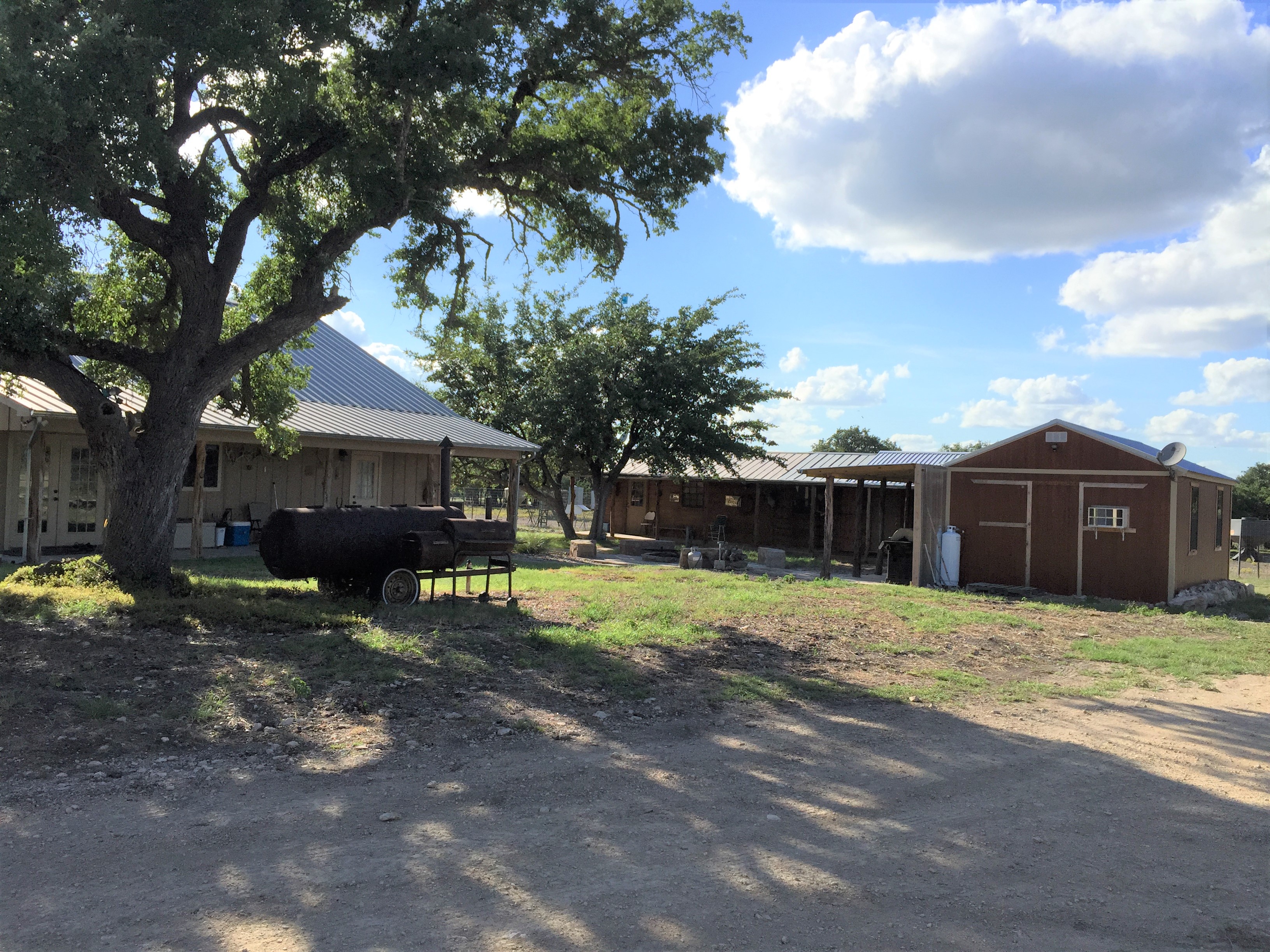Cabins and shaded grounds at the FF Hunting Ranch camp