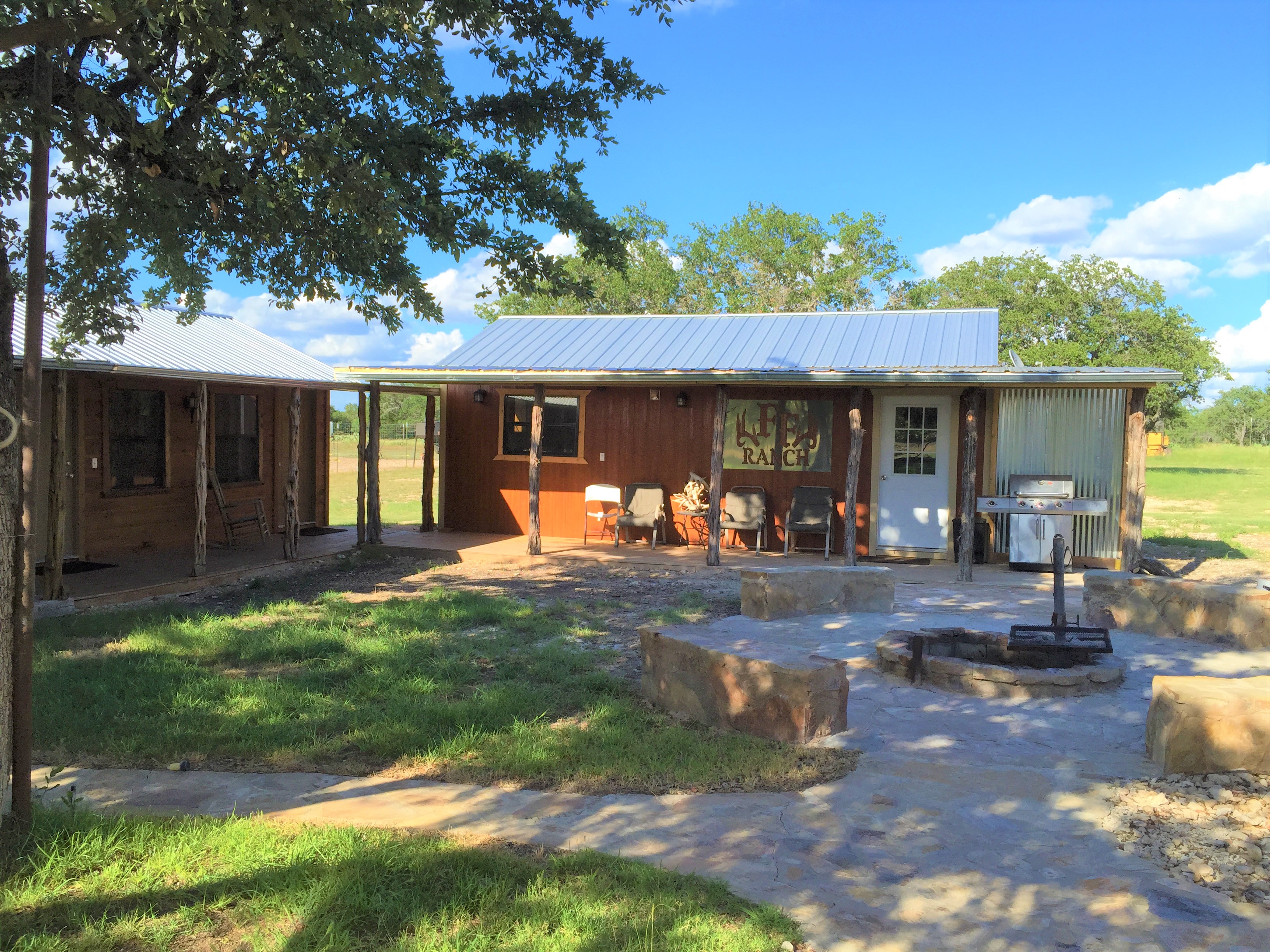 Covered patio and fire pit at the FF Hunting Ranch camp